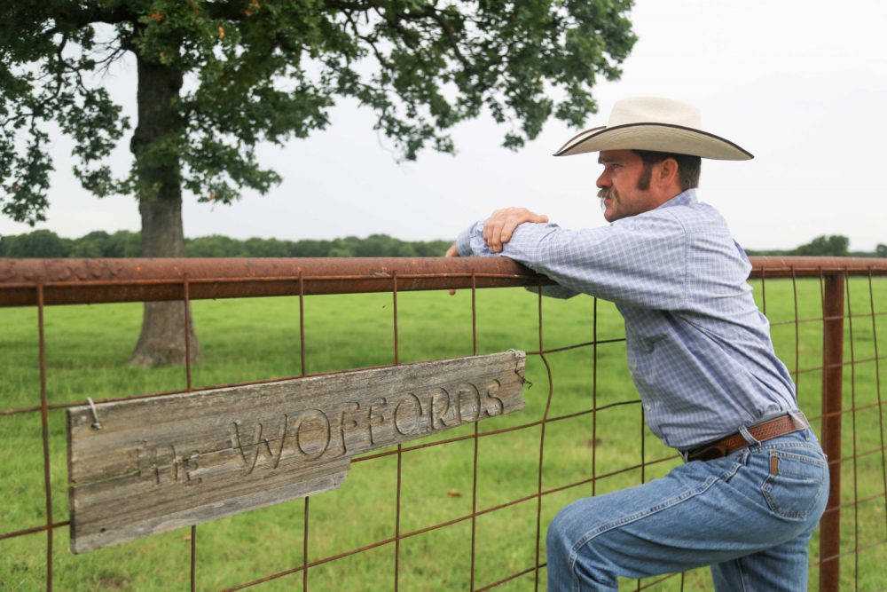 Craig Wofford Leaning on a fence